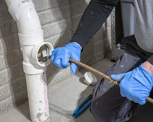 Professional drain cleaning service removing clogs from kitchen sink and bathroom drains in New Jersey
